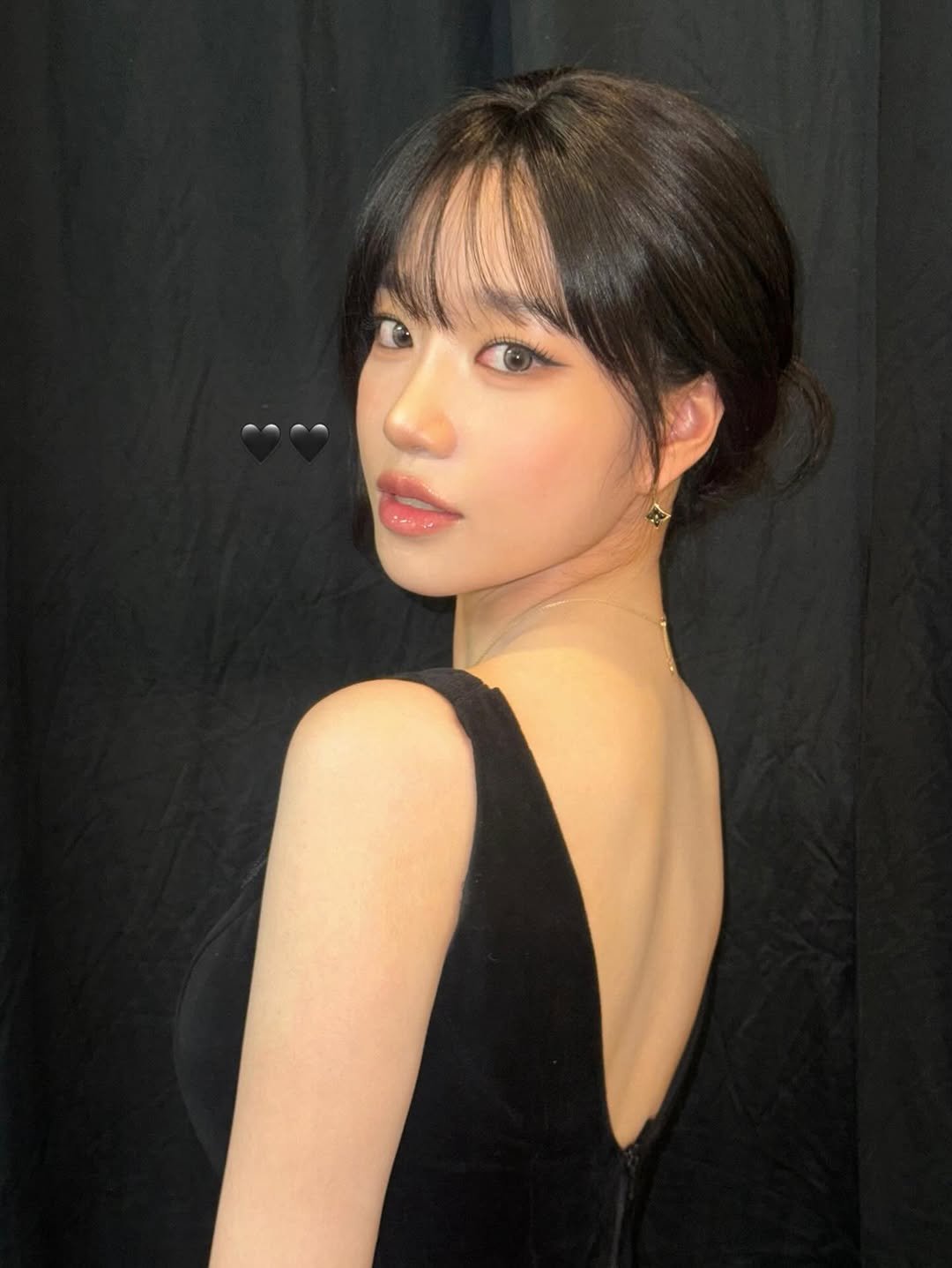 Photo by 조유리 JO YURI on December 20, 2025. May be an image of one or more people, bangs, top, dress and text.