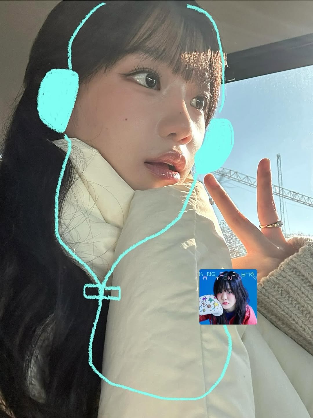 Photo by 조유리 JO YURI on December 05, 2025. May be an image of one or more people, hair, duffle coat, parka and turtleneck.