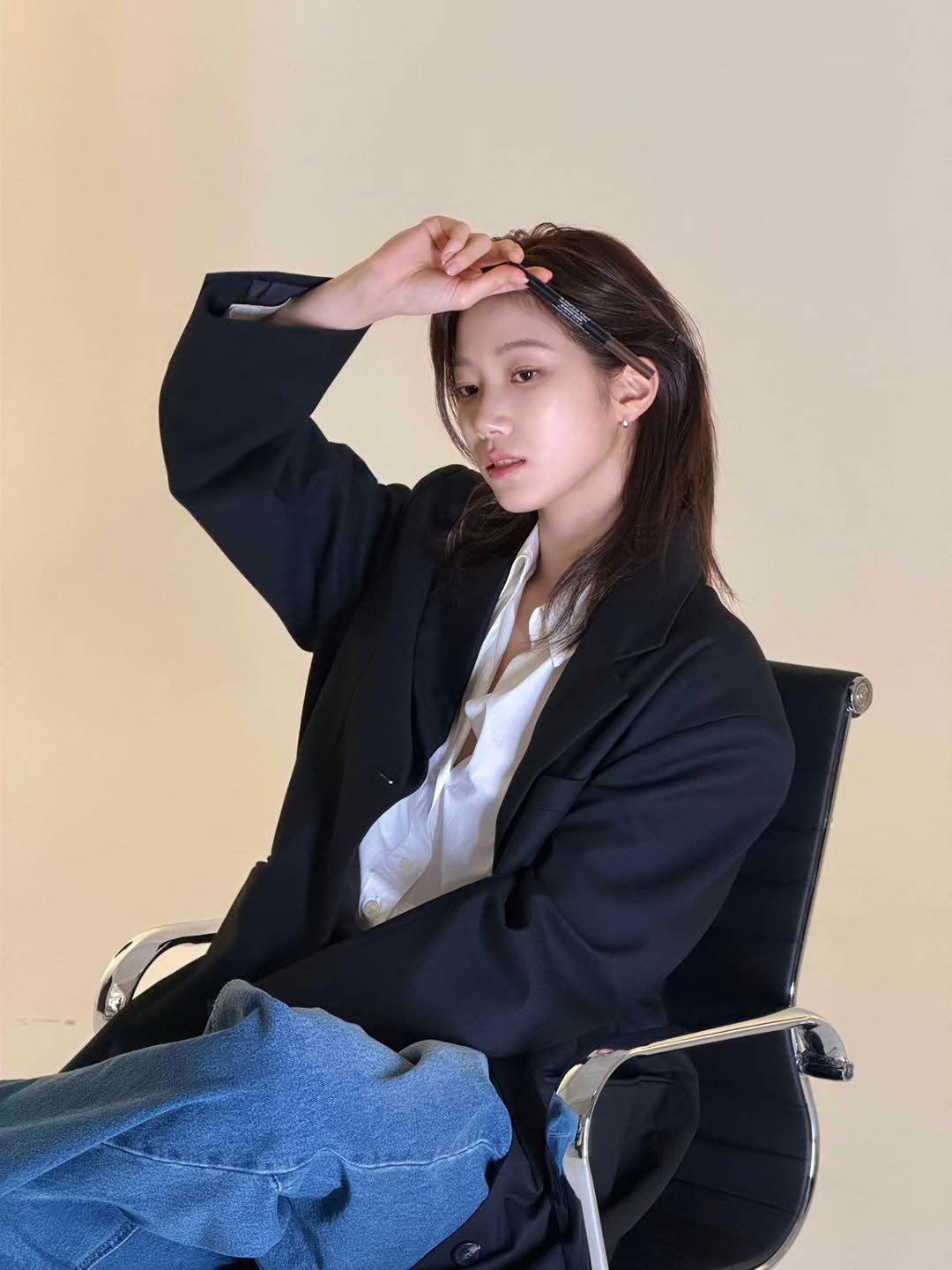 Photo shared by KAZUHA on March 19, 2026 tagging @vidivici.official. May be an image of one or more people, braids, suit, bolo tie, blazer and text.