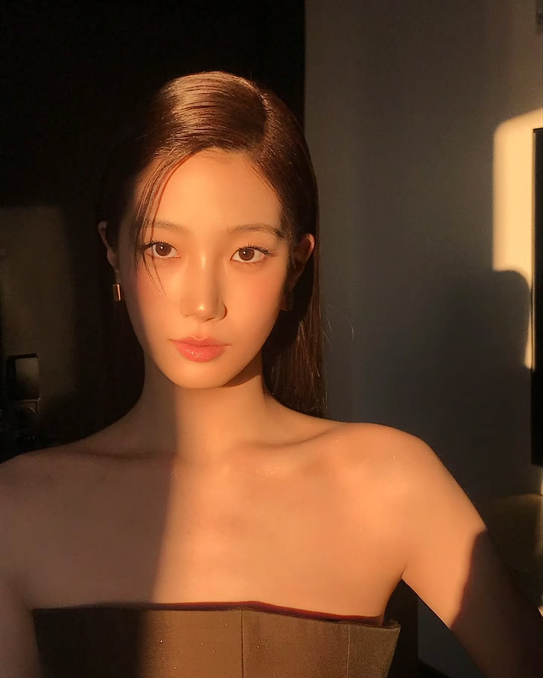 Photo shared by KAZUHA on February 14, 2026 tagging @khaite. May be an image of one or more people, hair, makeup, dress and text.