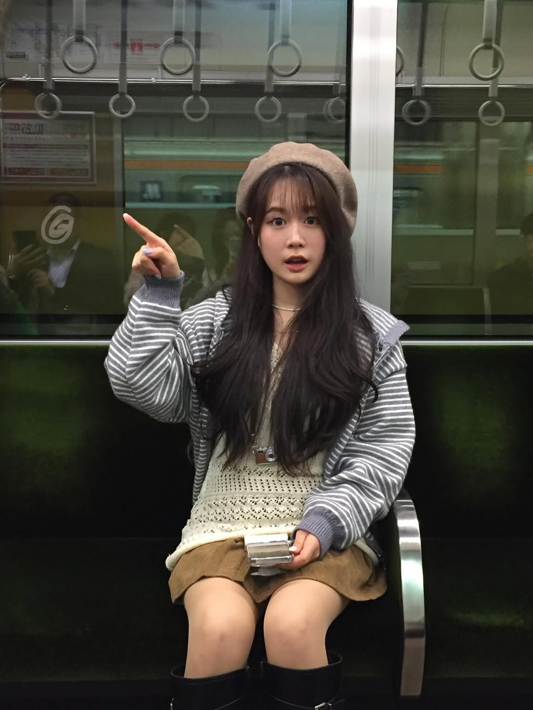 Photo shared by 지히지히 on March 13, 2026 tagging @zeekaboo0.0. May be an image of train, duffle coat, hat, bowler hat, parka, beret and text.